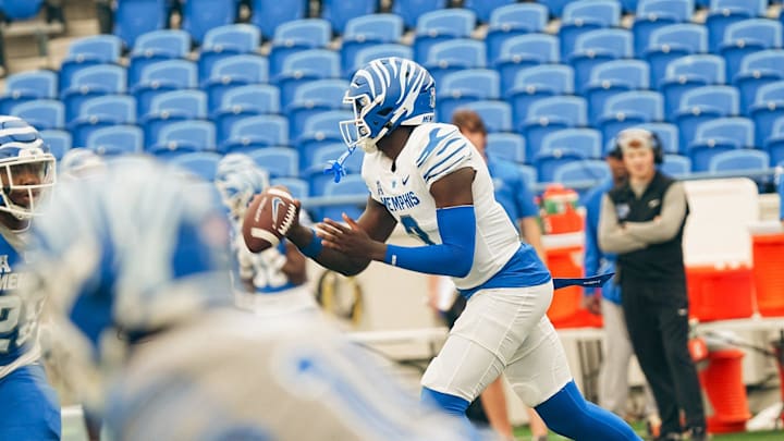 Quarterback AJ Hill (3) moves with the ball during a Memphis Tigers football spring game between the blue and gray team on Saturday, April 26, 2025 at Simmons Liberty Bank Stadium in Memphis, Tenn.