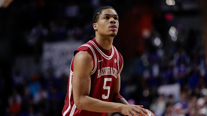 Feb 28, 2026; Gainesville, Florida, USA; Arkansas Razorbacks guard Darius Acuff Jr. (5) attempts a free throw against the Florida Gators during the first half at Exactech Arena at the Stephen C. O'Connell Center. Mandatory Credit: Travis Register-Imagn Images