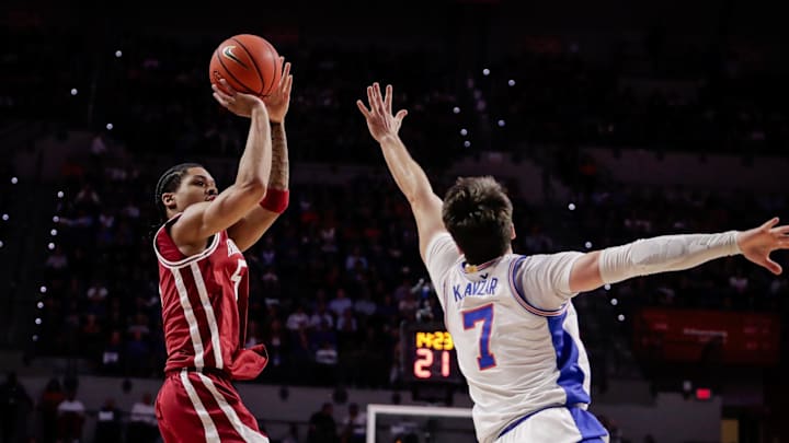 Feb 28, 2026; Gainesville, Florida, USA; Arkansas Razorbacks guard Darius Acuff Jr. (5) shoots against Florida Gators guard Urban Klavzar (7) during the first half at Exactech Arena at the Stephen C. O'Connell Center. Mandatory Credit: Travis Register-Imagn Images