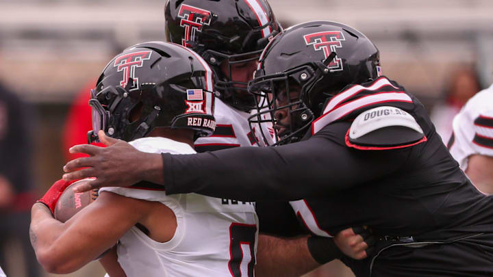 Lee Hunter wraps up Quinten Joyner for a tackle during the Texas Tech football team's spring game, Saturday, April 19, 2025, at Jones AT&T Stadium.