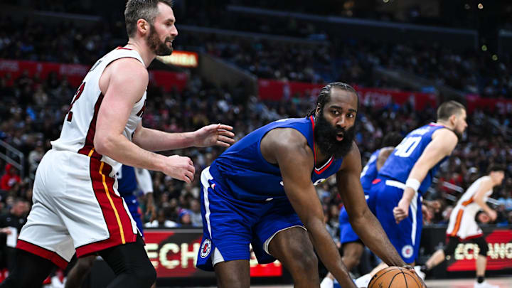 Jan 1, 2024; Los Angeles, California, USA; Los Angeles Clippers guard James Harden (1) looks to pass against Miami Heat forward Kevin Love (42) during the fourth quarter at Crypto.com Arena. Mandatory Credit: Jonathan Hui-Imagn Images