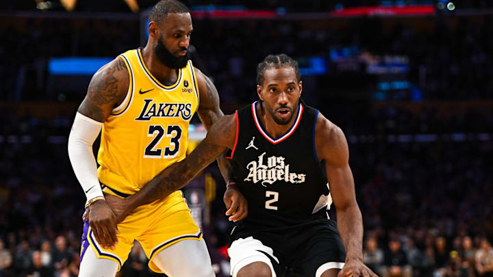 Nov 1, 2023; Los Angeles, California, USA;  LA Clippers forward Kawhi Leonard (2) moves the ball against Los Angeles Lakers forward LeBron James (23) during the second half at Crypto.com Arena. Mandatory Credit: Jonathan Hui-Imagn Images