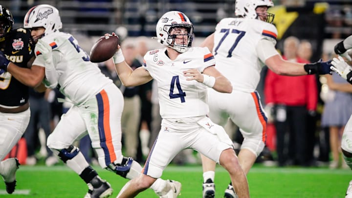 Dec 27, 2025; Jacksonville, FL, USA; Virginia Cavaliers quarterback Chandler Morris (4) throws a pass against the Missouri Tigers during the second quarter at EverBank Stadium. Mandatory Credit: Travis Register-Imagn Images