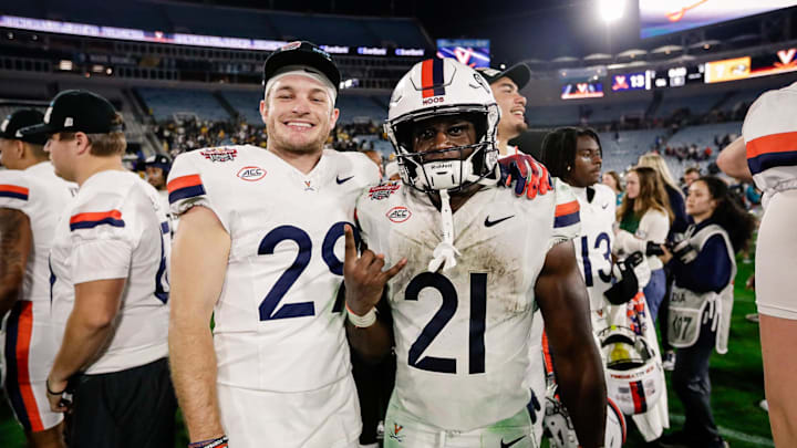 Dec 27, 2025; Jacksonville, FL, USA; Virginia Cavaliers running back Harrison Waylee (21) celebrates with running back Davis Lane Jr. (29) after defeating the Missouri Tigers at EverBank Stadium. Mandatory Credit: Travis Register-Imagn Images