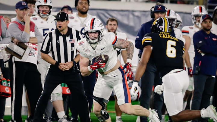 Dec 27, 2025; Jacksonville, FL, USA; Virginia Cavaliers tight end Sage Ennis (0) runs after a catch against the Missouri Tigers during the fourth quarter at EverBank Stadium. Mandatory Credit: Travis Register-Imagn Images