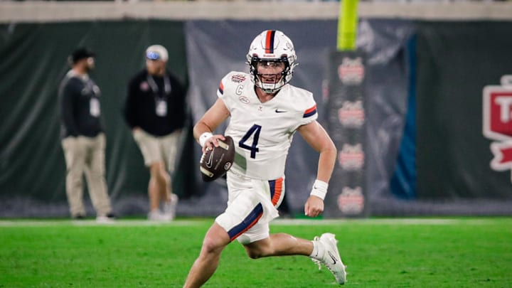 Dec 27, 2025; Jacksonville, FL, USA; Virginia Cavaliers quarterback Chandler Morris (4) runs the ball against the Missouri Tigers during the fourth quarter at EverBank Stadium. Mandatory Credit: Travis Register-Imagn Images