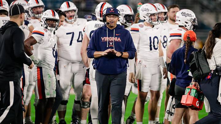 Dec 27, 2025; Jacksonville, FL, USA; Virginia Cavaliers head coach Tony Elliott looks on during a timeout against the Missouri Tigers during the second quarter at EverBank Stadium. Mandatory Credit: Travis Register-Imagn Images Dec 27, 2025; Jacksonville, FL, USA; Virginia Cavaliers head coach Tony Elliott looks on during a timeout against the Missouri Tigers during the second quarter at EverBank Stadium. Mandatory Credit: Travis Register-Imagn Images