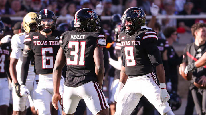 Texas Tech's David Bailey (31) celebrates a sack with teammates Romello Height (9) and John Curry a Big 12 Conference football game, Saturday, Nov. 15, 2025, at Jones AT&T Stadium.