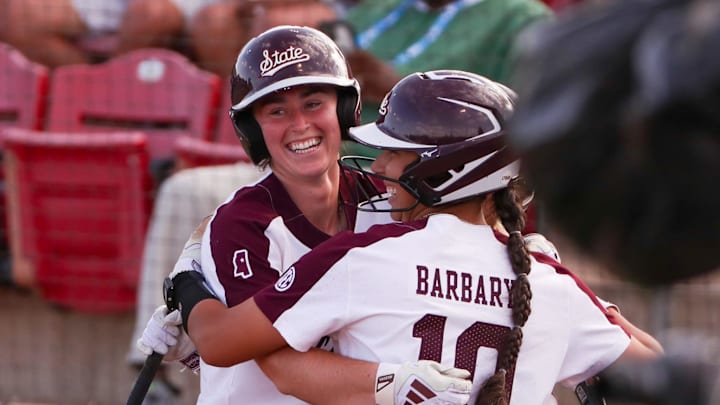 Mississippi State's Jessie Blaine hugs teammates after hitting a home run during a game in the Lubbock Regional of the 2025 NCAA softball tournament, Saturday, May 17, 2025, at Rocky Johnson Field. Mississippi State's Jessie Blaine hugs teammates after hitting a home run during a game in the Lubbock Regional of the 2025 NCAA softball tournament, Saturday, May 17, 2025, at Rocky Johnson Field.