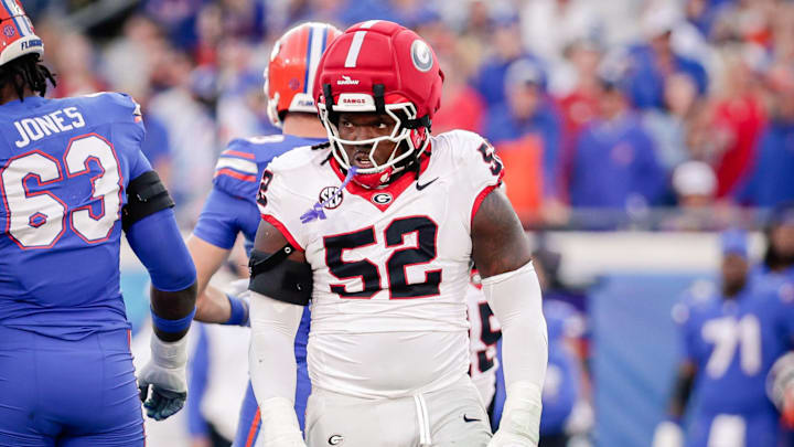 Nov 1, 2025; Jacksonville, Florida, USA; Georgia Bulldogs defensive lineman Christen Miller (52) reacts after making a tackle against the Florida Gators at EverBank Stadium. Nov 1, 2025; Jacksonville, Florida, USA; Georgia Bulldogs defensive lineman Christen Miller (52) reacts after making a tackle against the Florida Gators at EverBank Stadium.