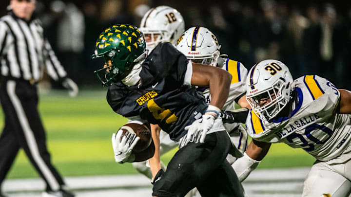 Birmingham Groves' Noah Sanders rushes during the Division 2 football regional final on Friday, Nov. 15, 2024.