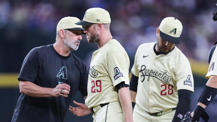 Arizona Diamondbacks pitcher Merrill Kelly (29) is taken out of the game by manager Torey Lovullo at Chase Field on Aug. 31, 2024, in Phoenix. Arizona Diamondbacks pitcher Merrill Kelly (29) is taken out of the game by manager Torey Lovullo at Chase Field on Aug. 31, 2024, in Phoenix.