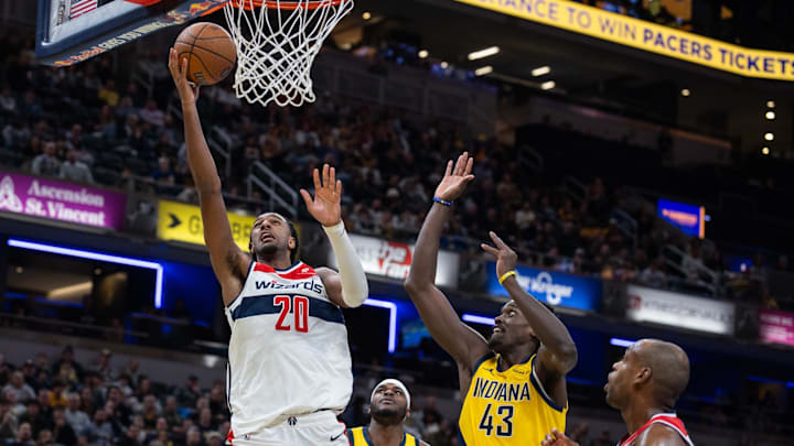 Nov 28, 2025; Indianapolis, Indiana, USA; Washington Wizards center Alex Sarr (20) shoots the ball while Indiana Pacers forward Pascal Siakam (43) defends in the second half at Gainbridge Fieldhouse. Mandatory Credit: Trevor Ruszkowski-Imagn Images