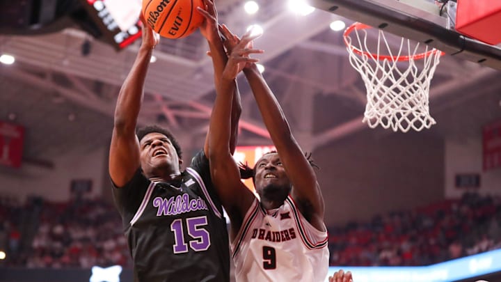 Kansas State's Taj Manning battles Texas Tech's Luke Bamgboye for a rebound during a Big 12 Conference men's basketball game, Saturday, Feb. 21, 2026, in United Supermarkets Arena.