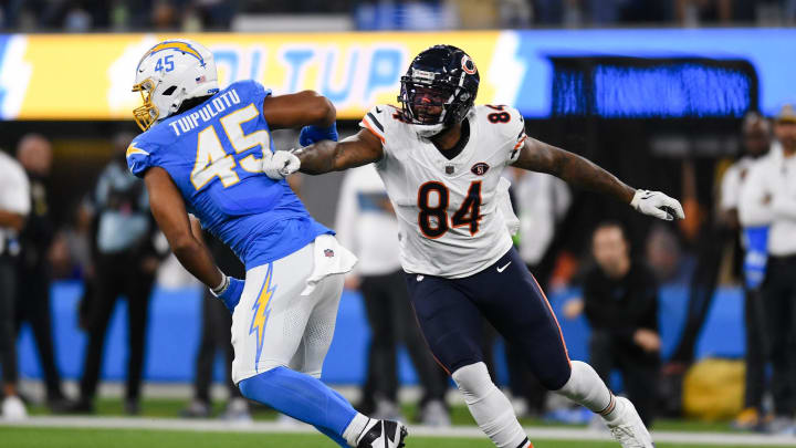 Oct 29, 2023; Inglewood, California, USA; Chicago Bears tight end Marcedes Lewis (84) attempts to block Los Angeles Chargers linebacker Tuli Tuipulotu (45) during second quarter at SoFi Stadium. Mandatory Credit: Jonathan Hui-USA TODAY Sports