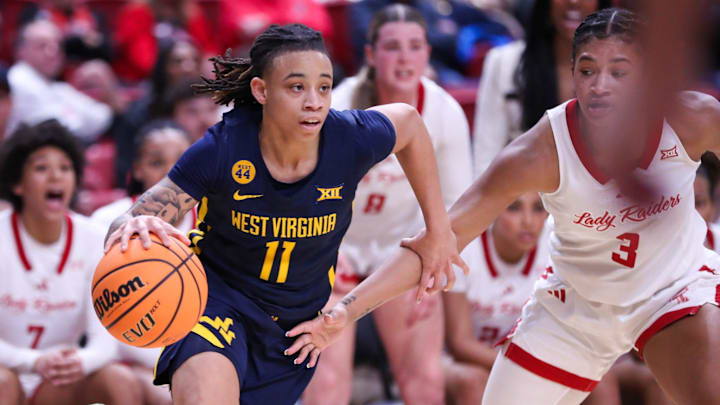 West Virginia's JJ Quinerly dribbles against Texas Tech during a Big 12 Conference women's basketball game, Wednesday, Jan. 8, 2025, in United Supermarkets Arena.