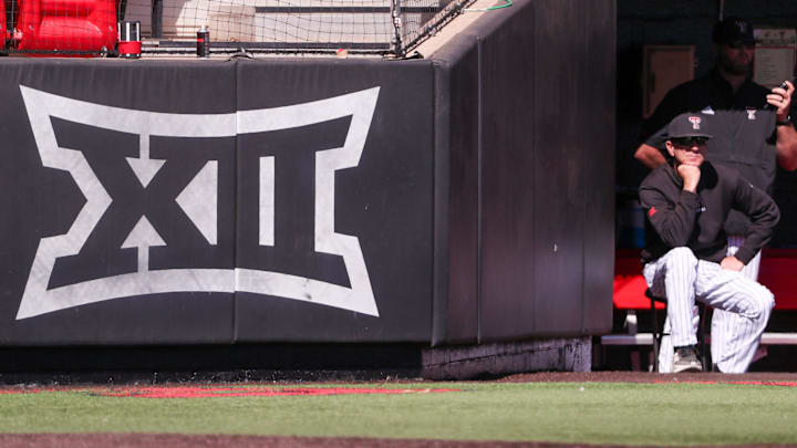 Texas Tech head coach Tim Tadlock sits next to the Big 12 Conference logo during a non-conference Division I baseball game, Wednesday, March 5, 2025, at Dan Law Field.