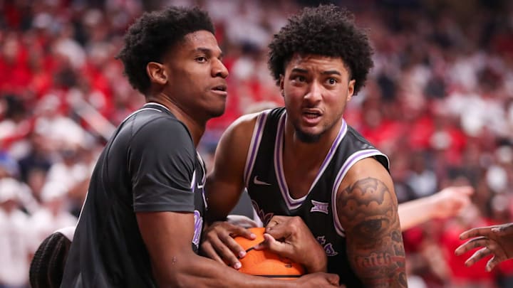 Kansas State players Taj Manning (left) and PJ Haggerty battle for a rebound against Texas Tech during a Big 12 game Saturday.