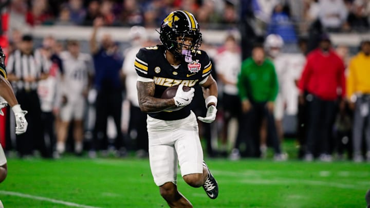 Dec 27, 2025; Jacksonville, FL, USA; Missouri Tigers wide receiver Kevin Coleman Jr. (3) runs the ball against the Virginia Cavaliers during the third quarter at EverBank Stadium. Mandatory Credit: Travis Register-Imagn Images