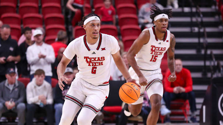 Texas Tech's Darrion Williams (5) and JT Toppin run up court against Wyoming during a non-conference basketball game, Wednesday, Nov. 13, 2024, in United Supermarkets Arena.