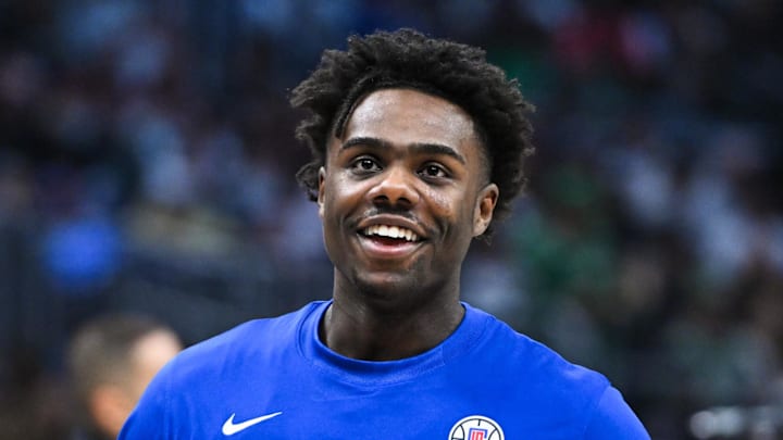 Dec 23, 2023; Los Angeles, California, USA; Los Angeles Clippers forward Kobe Brown (21) before the game against the Boston Celtics during warmups at Crypto.com Arena. Mandatory Credit: Jonathan Hui-Imagn Images