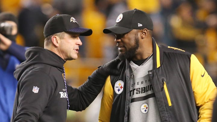 Dec 10, 2017; Pittsburgh, PA, USA;  Baltimore Ravens head coach John Harbaugh (left) and Pittsburgh Steelers head coach Mike Tomlin (right) meet at mid-field before their teams play at Heinz Field. Mandatory Credit: Charles LeClaire-Imagn Images