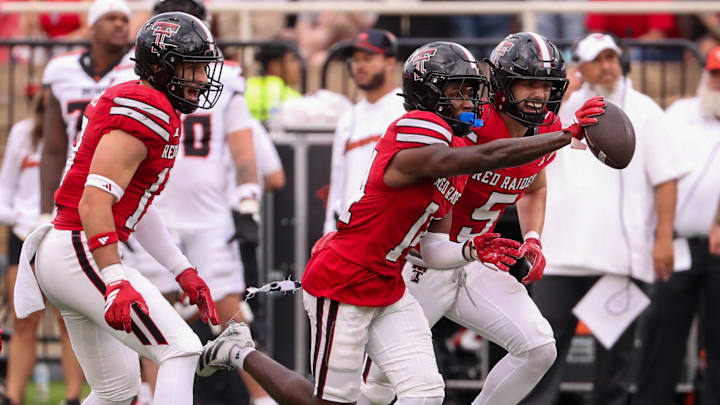 Texas Tech's Brice Pollock (center) celebrates his interception with Cole Wisniewski and Ben Roberts against Oregon State during a non-conference football game, Saturday, Sept. 13, 2025, at Jones AT&T Stadium.