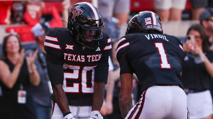 Texas Tech's Reggie Virgil celebrates his touchdown with J'Koby Williams during a Big 12 Conference football game, Saturday, Nov. 15, 2025, at Jones AT&T Stadium.