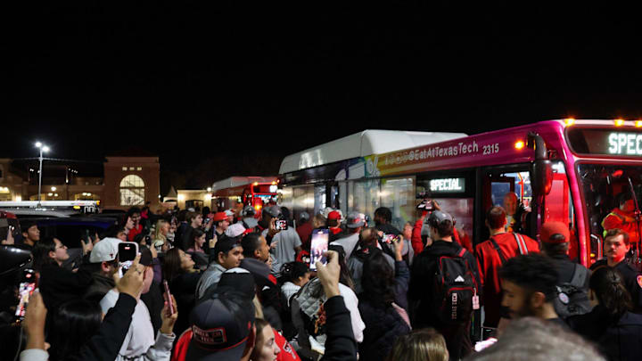 Texas Tech fans cheer as the Red Raiders return to Lubbock after winning the Big 12 Championship against the BYU Cougars. Texas Tech fans cheer as the Red Raiders return to Lubbock after winning the Big 12 Championship against the BYU Cougars.