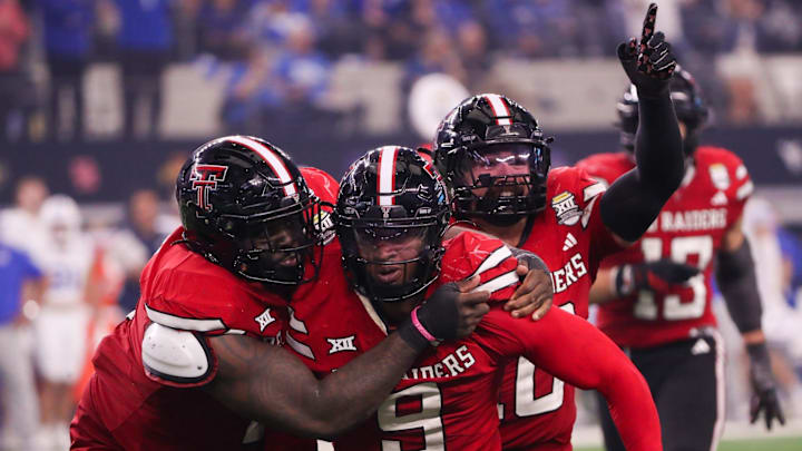 Texas Tech Red Raiders' teammates celebrate together during the Big 12 Championship Game. 