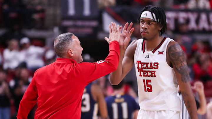 Texas Tech head coach Grant McCasland high-fives JT Toppin during a non-conference basketball game, Friday, Nov. 29, 2024, at United Supermarkets Arena.