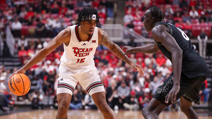 Texas Tech's JT Toppin dribbles against Colorado defender Bangot Dak during a Big 12 Conference men's basketball game, Wednesday, Feb. 11, 2026, in United Supermarkets Arena.