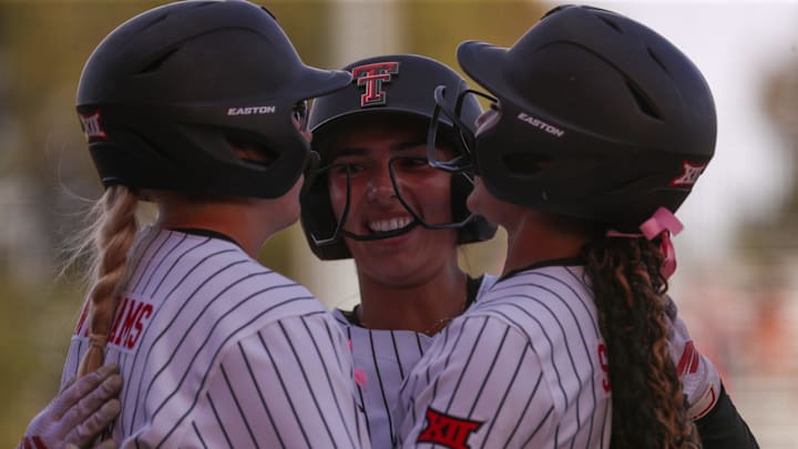 Texas Tech's Lauren Allred with Mia Williams and Desirae Spearman.