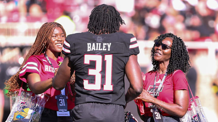 Texas Tech's David Bailey talks to his family during the senior day ceremony before a Big 12 Conference football game, Saturday, Nov. 15, 2025, at Jones AT&T Stadium.