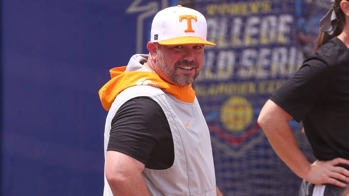 Tennessee assistant coach Craig Snider looks on during his team's practice ahead of the Women's College World Series. Tennessee assistant coach Craig Snider looks on during his team's practice ahead of the Women's College World Series.