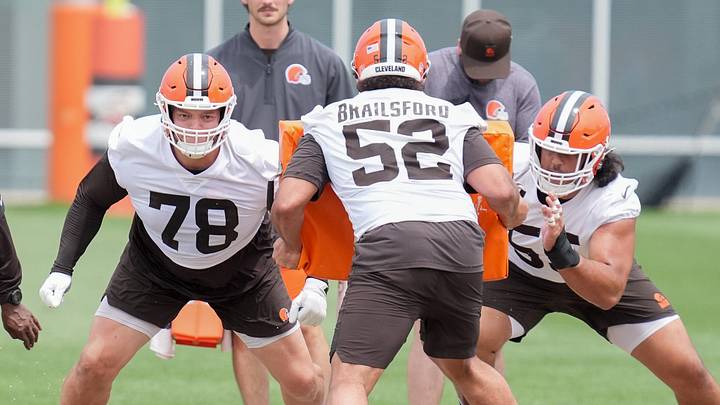 Teven Jenkins and Spencer Fano work with Parker Braiilsford at the Browns OTA in Berea on May 27, 2026.