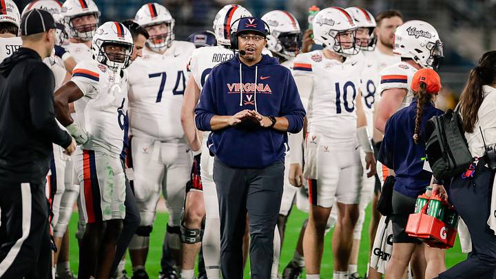Dec 27, 2025; Jacksonville, FL, USA; Virginia Cavaliers head coach Tony Elliott looks on during a timeout against the Missouri Tigers during the second quarter at EverBank Stadium. Mandatory Credit: Travis Register-Imagn Images Dec 27, 2025; Jacksonville, FL, USA; Virginia Cavaliers head coach Tony Elliott looks on during a timeout against the Missouri Tigers during the second quarter at EverBank Stadium. Mandatory Credit: Travis Register-Imagn Images