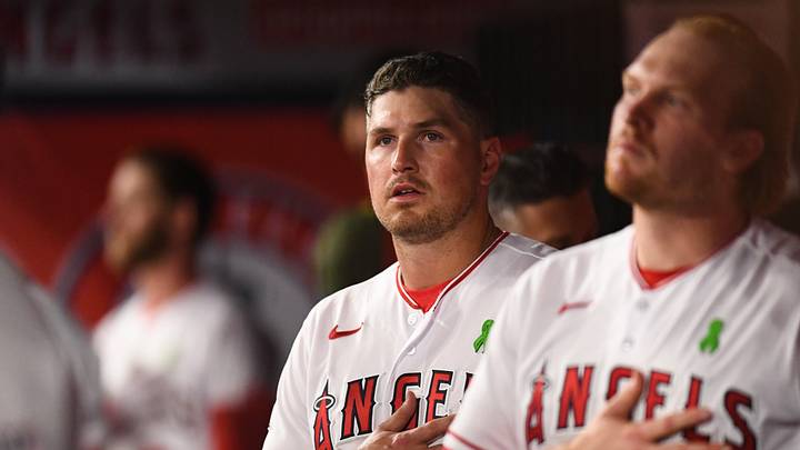 May 20, 2023; Anaheim, California, USA; Los Angeles Angels right fielder Hunter Renfroe (12) and catcher Chad Wallach (35) in the dugout during the seventh inning stretch against Minnesota Twins at Angel Stadium. May 20, 2023; Anaheim, California, USA; Los Angeles Angels right fielder Hunter Renfroe (12) and catcher Chad Wallach (35) in the dugout during the seventh inning stretch against Minnesota Twins at Angel Stadium.