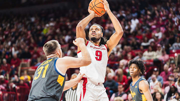 Jonas Aidoo rises (9) rises for a shot over North Carolina A&T's Efstratios Kalliontzis (31) inside Bud Walton Arena. The Razorbacks won 95-67. Jonas Aidoo rises (9) rises for a shot over North Carolina A&T's Efstratios Kalliontzis (31) inside Bud Walton Arena. The Razorbacks won 95-67.