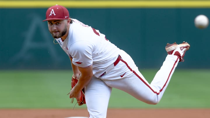 Arkansas Razorbacks pitcher Zach Root throws against the Tennessee Volunteers  in an NCAA Super Regional in Fayetteville, Ark.