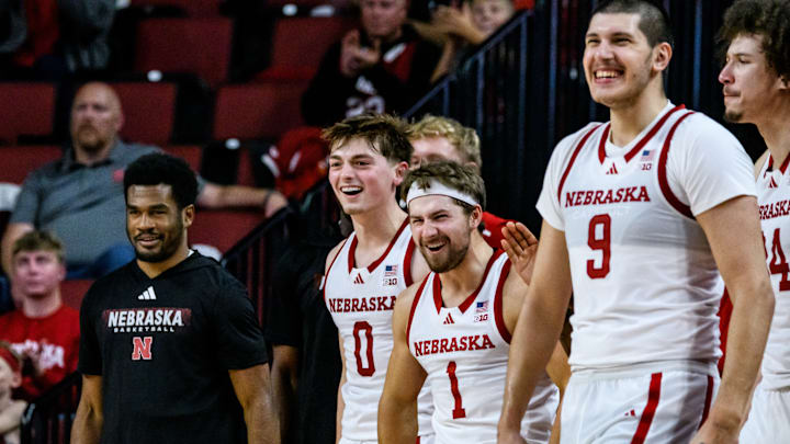 Connor Essegian (0), Sam Hoiberg (1) and Berke Büyüktuncel (9) celebrate a Huskers three pointer. 