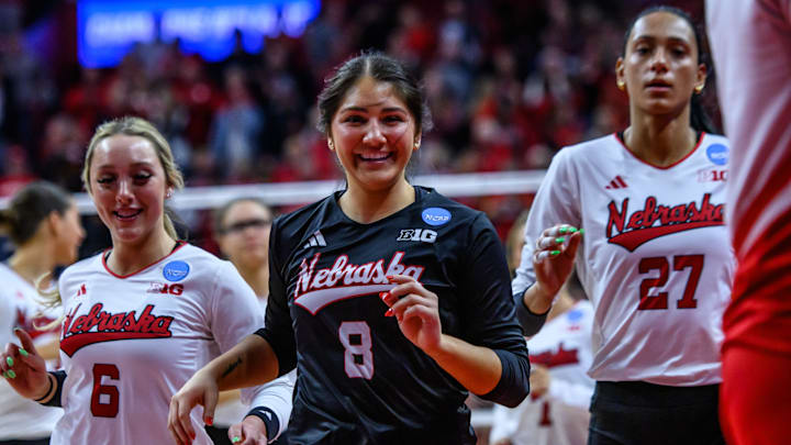 Lexi Rodriguez (8) and Laney Choboy (6) smile as they run off the court after advancing to the Elite Eight. 