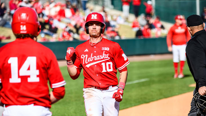 Drew Grego pumps his fist has he crosses home plate to score in the seventh inning versus Indiana.