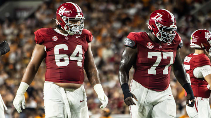 Alabama offensive lineman Michael Carroll (64) and Jaeden Roberts (77)