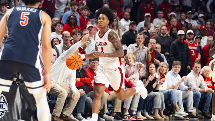 Alabama guard Aden Holloway travels up the court in the first half of the CM Newton Classic on Dec. 13, 2025. Alabama guard Aden Holloway travels up the court in the first half of the CM Newton Classic on Dec. 13, 2025.