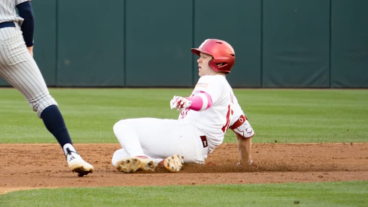 Alabama catcher Brady Neal slides to second in the first game of the series against Rhode Island on Feb. 20, 2026.