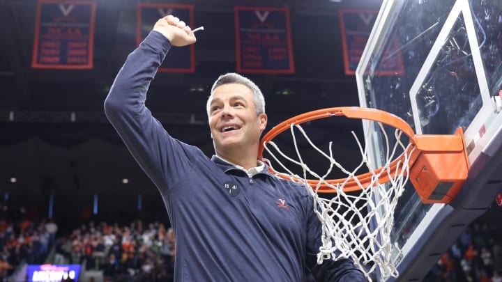 Tony Bennett cuts the net to celebrate Virginia men's basketball winning a share of the 2022-2023 ACC regular season title. Tony Bennett cuts the net to celebrate Virginia men's basketball winning a share of the 2022-2023 ACC regular season title.