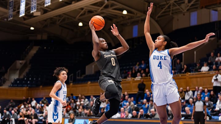 Milan Brown (0) attempts a shot against the Duke Blue Devils.