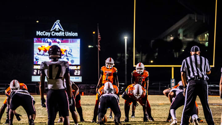 Jones quarterback Dereon Coleman (1), a Miami signee, completed 19 of 27 passes for 278 yards and two touchdowns and ran 13 times for 101 yards to power the defending Class 4A state runner-up Tigers past Port Charlotte, 35-23, in a state semifinal game on Friday, Dec. 5, 2025.