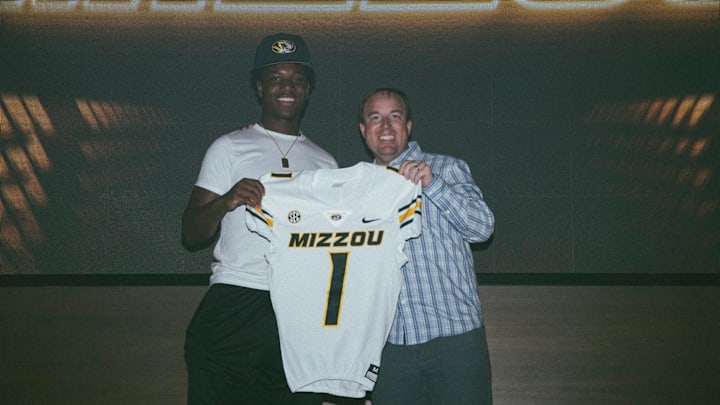 Theodore High School linebacker JJ Bush, alongside Missouri Tigers head coach Eliah Drinkwitz, on an official visit to the University of Missouri in Columbia on Sunday, June 1, 2025. 
